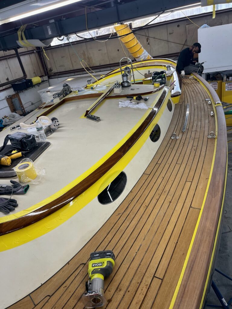Reaming out old compound from teak deck for re-seam and re-varnish​Ing brightwork, February 6, 2026 (Photo: Ted Fontaine)